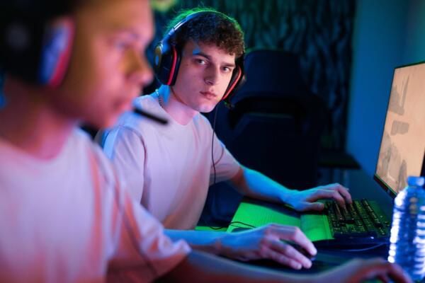 a man playing games on a computer